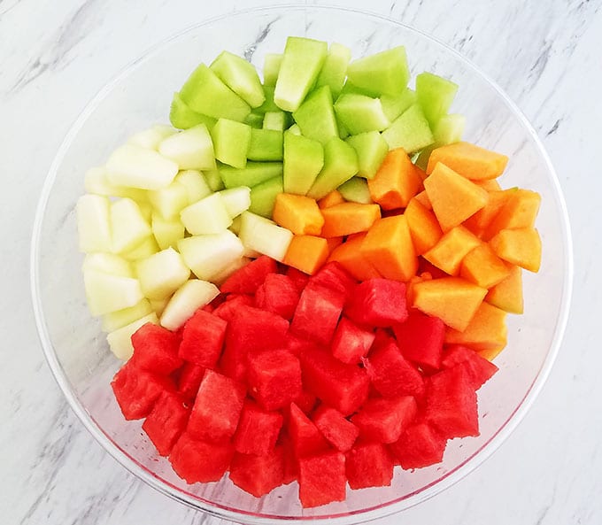 Melon Fruit Salad with Honey Lime and Watermelon Juice Dressing