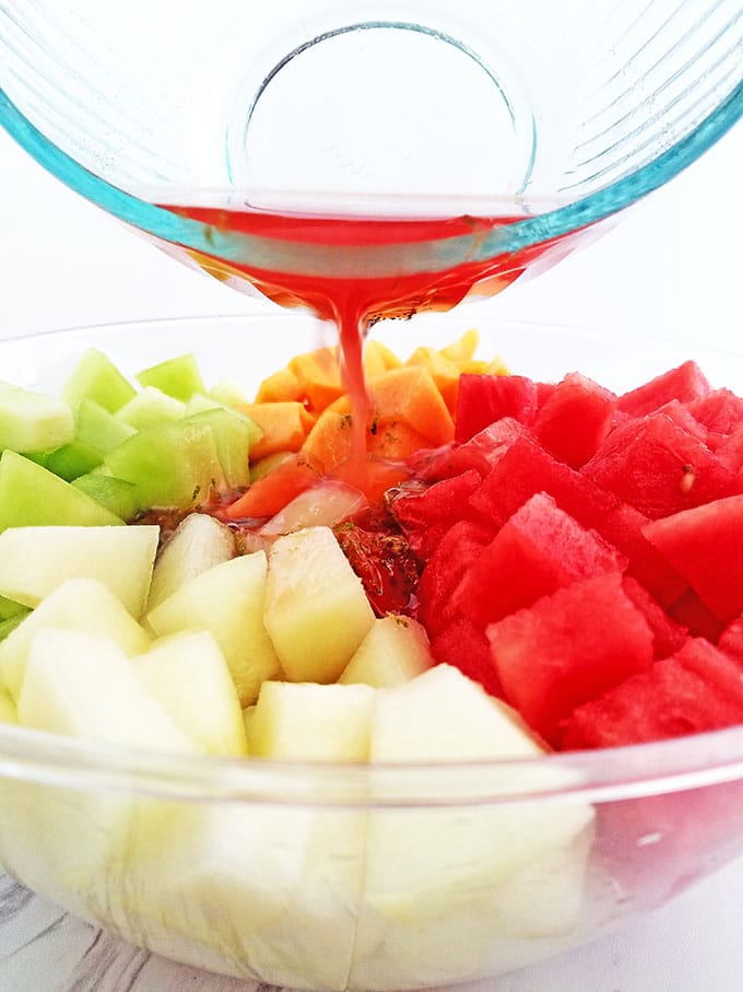 What can be better than a bowl of chilled Melon Fruit Salad with Honey Lime and Watermelon Juice Dressing on a hot summer day? While you shouldn’t abandon your water consumption, a nice bowl of this refreshing watery fruit with a touch of sweetness is sure to hit that thirsty and sweet spot. It’s a brilliant addition to any outdoor party.