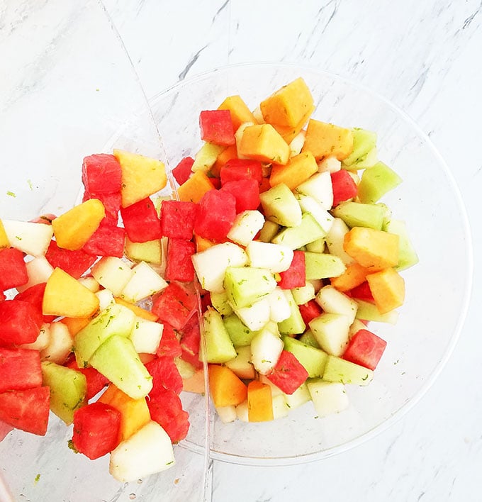 What can be better than a bowl of chilled Melon Fruit Salad with Honey Lime and Watermelon Juice Dressing on a hot summer day? While you shouldn’t abandon your water consumption, a nice bowl of this refreshing watery fruit with a touch of sweetness is sure to hit that thirsty and sweet spot. It’s a brilliant addition to any outdoor party.