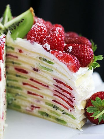 This Crepe Cake is a delicious, beautiful dessert that combines the delicate elegance of crepes with a tasty cream filling and vibrant bursts of fresh fruits.