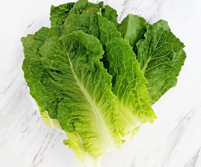 Start by separating, rinsing, and patting dry with a paper towel for each Romaine lettuce leaf.