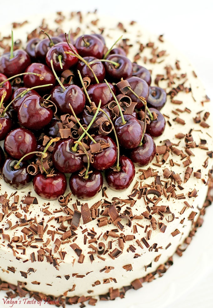 This Drunken Cherry Cake Recipe is loaded with two pounds of lightly cooked cherries, topped with a pound of fresh cherries, caramel cream, and fluffy chocolate cake sponge, and finally sprinkled with shaved best-tasting organic chocolate, it’s fair to say that self-control takes a little more effort around this exquisite goodness. #drunkencherrycake #freshcherries #caramelcream #valyastasteofhome