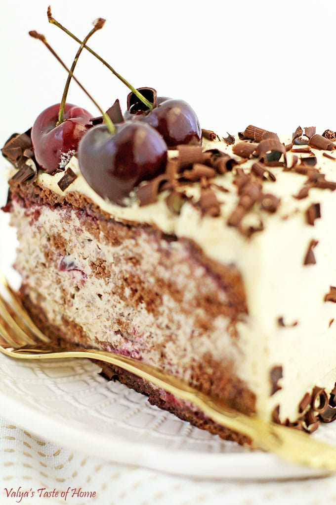 This Drunken Cherry Cake Recipe is loaded with two pounds of lightly cooked cherries, topped with a pound of fresh cherries, caramel cream, and fluffy chocolate cake sponge, and finally sprinkled with shaved best-tasting organic chocolate, it’s fair to say that self-control takes a little more effort around this exquisite goodness. #drunkencherrycake #freshcherries #caramelcream #valyastasteofhome