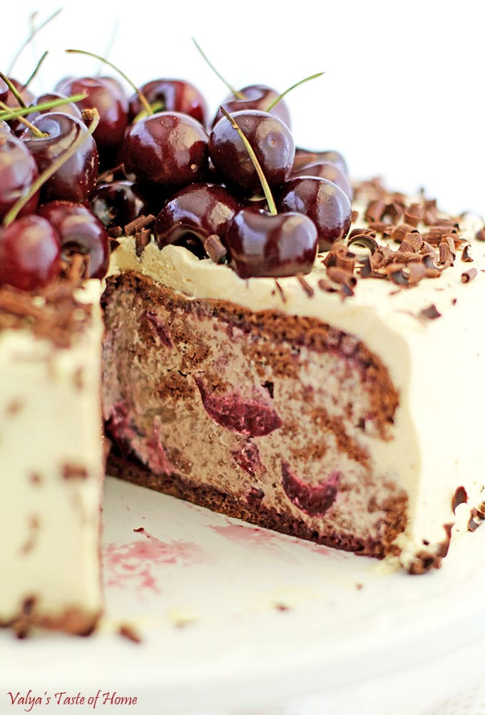 This Drunken Cherry Cake Recipe is loaded with two pounds of lightly cooked cherries, topped with a pound of fresh cherries, caramel cream, and fluffy chocolate cake sponge, and finally sprinkled with shaved best-tasting organic chocolate, it’s fair to say that self-control takes a little more effort around this exquisite goodness. #drunkencherrycake #freshcherries #caramelcream #valyastasteofhome