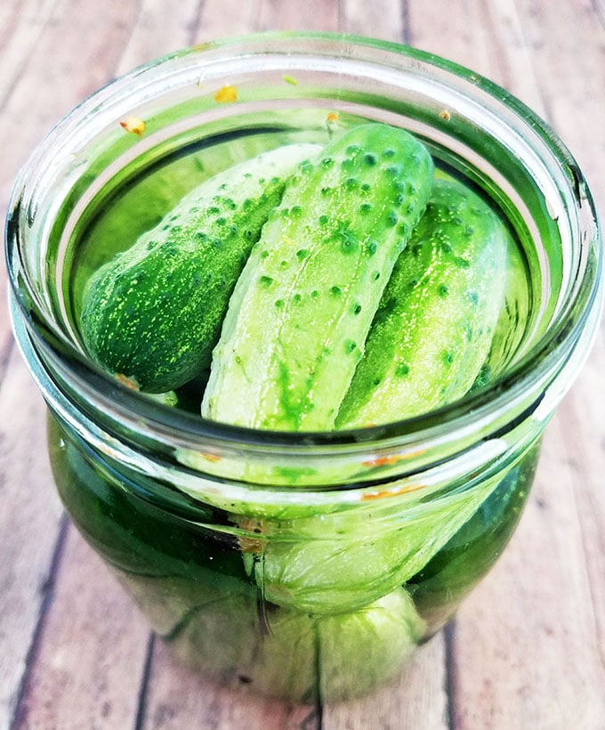 Fill each jar of pickles with the pickling syrup.