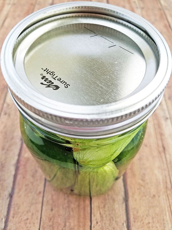 Cover each jar with a lid.