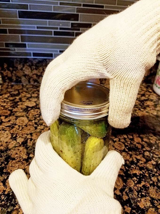 Screw the lid pretty tight using your hands with a canning glove.