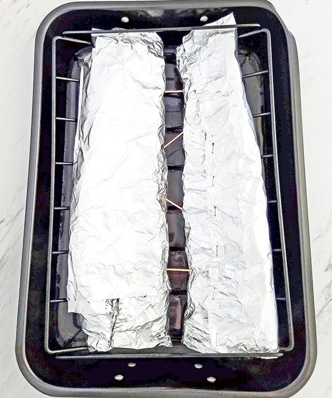 Pour 4 cups of boiling water onto the bottom of the pan. This step the meat super soft and moist.