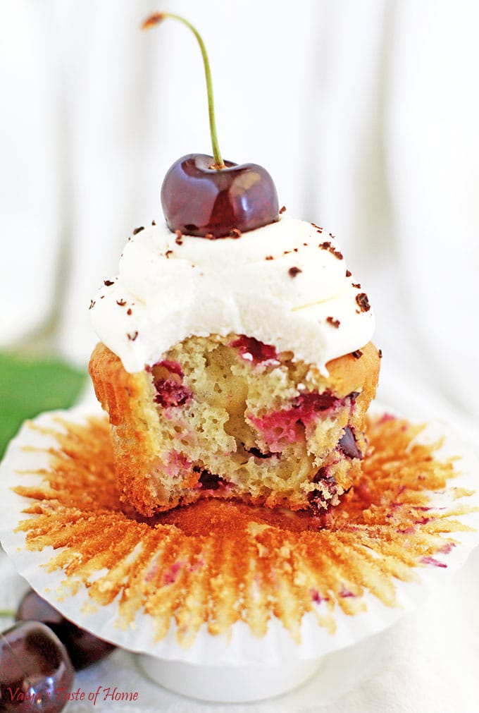 It’s a cherry season and flying by way too fast! I absolutely love cherries. So what does all that add up to? Of course, another Cherry Vanilla Cupcakes Recipe in the form of delicious single-serving dessert. These cupcakes are not only beautiful but incredibly tasty, fluffy, moist, light, and loaded with fresh cherries.