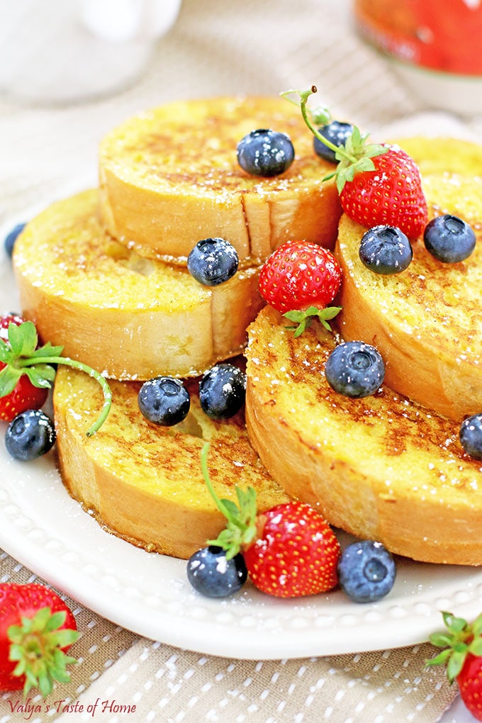 This Mom's French Toast Recipe is made out of homemade French bread slices dipped in a tasty combination of home-raised eggs, sugar, salt, and vanilla mixture, sautéed in butter make them taste so scrumptious, pillow-soft, that melt in your mouth in sweet delight. 