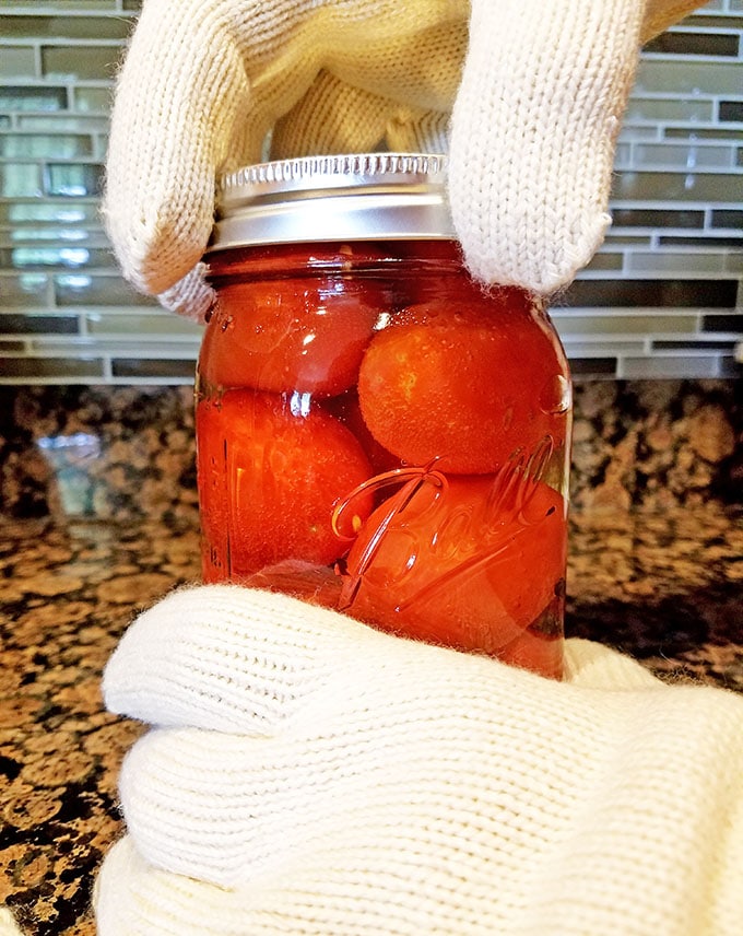 I grew up with canning fruits and vegetables with my mom and still enjoy doing it to this day. I’ve tried a few different blends in the past. This particular Canned Tomatoes Recipe is my aunt Lyuda’s, and the one that takes the number one spot for me. 