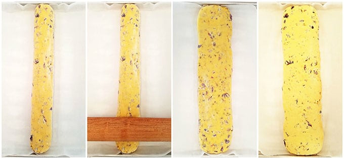 Next, place the log onto a baking sheet lined with parchment paper. Flatten the log flat to ¾ inch thick with a rolling pin.