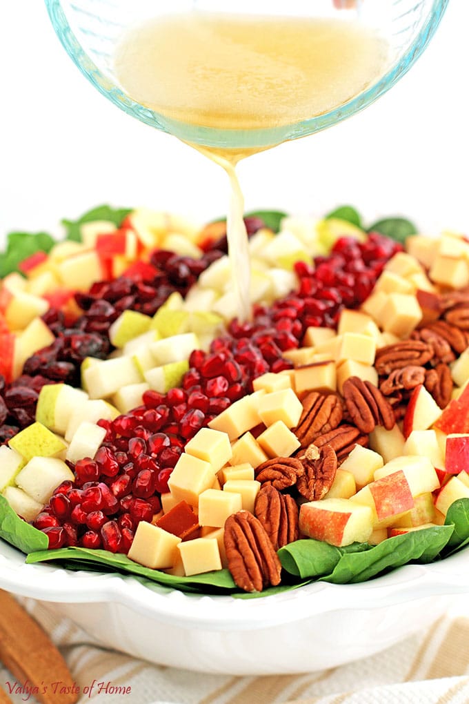 What is there not to love about fresh and beautiful salad? This Pear Apple Pomegranate Pecan Spinach Salad Recipe is so easy to make and is such an attractive addition to your table. #pearapplepomegranatepecanspinachsalad #spinachsaladrecipe #holidaysalad #thanksgivingsalad #christmassalad #valyastasteofhome