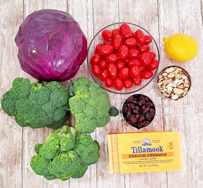 almond slivers, cheddar cheese, cranberries, Creamy Cheddar Broccoli and Tomato Salad Recipe, Greek yogurt, Greek yogurt ranch dressing, healthy, Homemade Ranch Dressing, natural bacon, red cabbage, vegetarian, winter vegetable salad