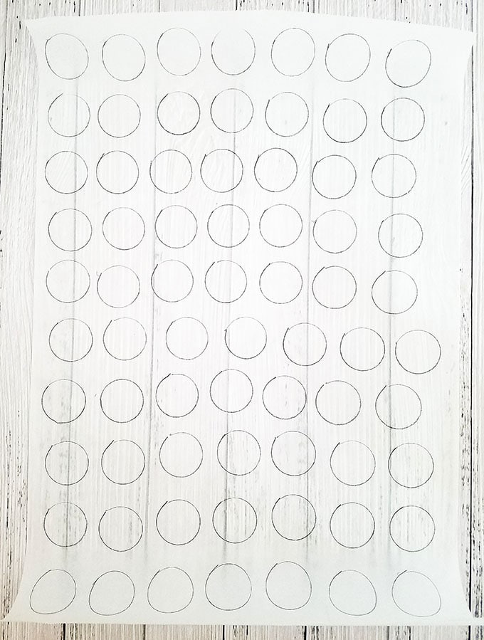 Start by drawing one-inch circles on the parchment paper.