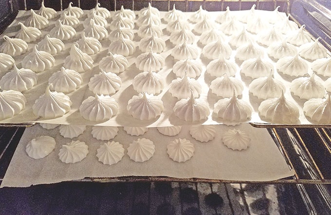 Bake meringue cookies for 3 hours at 175 F (79 C). After the cookies are done baking turn the oven off and let them cool in the oven. 