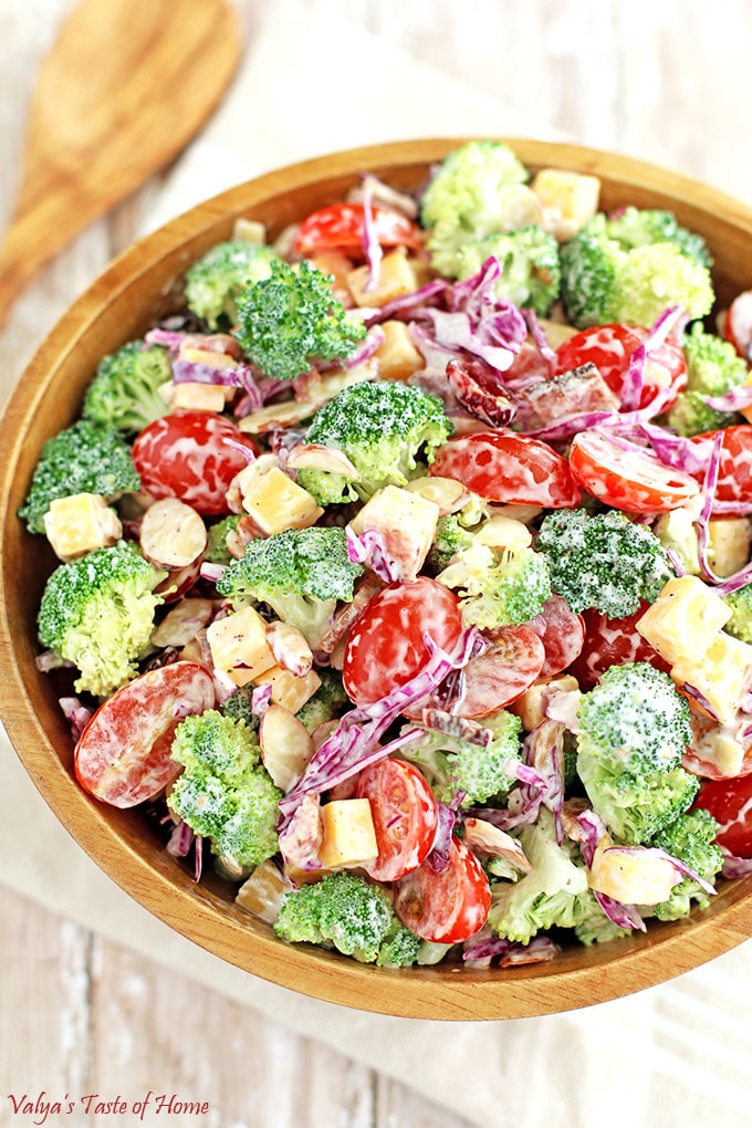 This Creamy Cheddar Broccoli and Tomato Salad Recipe is a great addition to your holiday feast or any occasion at any time of the year. Surprise and delight your family or guests with this different but totally delicious and beautiful looking salad on your table. Its taste is so flavorful, crisp, refreshing and satisfying, it is sure to impress! #creamybroccoliandtomatosalad #holidaysalad #creamycheddarbroccolitomatosalad #valyastasteofhome