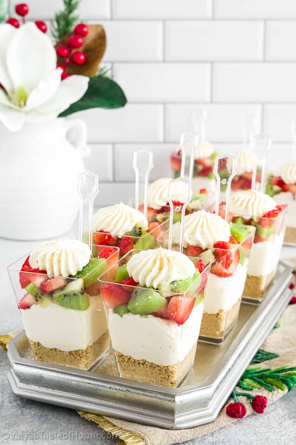 And this particular recipe is for Strawberry Kiwi Cheesecake Parfaits that have a delicious graham cracker crust layer, topped with a cheesecake filling, and topped with strawberries and kiwis.