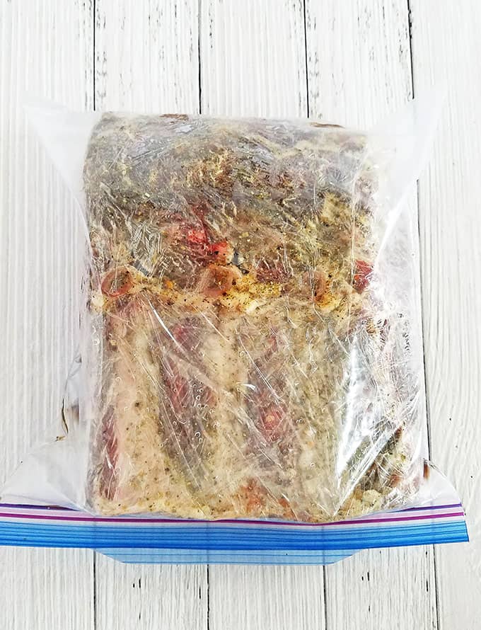 Place the roast into a gallon-size Ziploc bag and refrigerate it for 8 to 12 hours to let it marinate. 