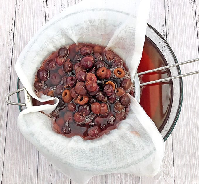 Place a strainer lined with cheesecloth over a large bowl. Strain the cooled cherry juice to separate the cherries from the juice.