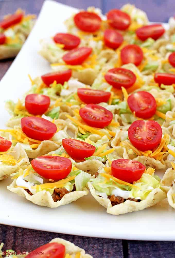 beautiful appetizers, cheddar cheese, Cinco de Mayo, decor appetizer, delicious appetizers, holiday food, kids aproved, kids love it, lettuce, mini cherry tomatoes, mini tacos, Taco Bites Appetizers