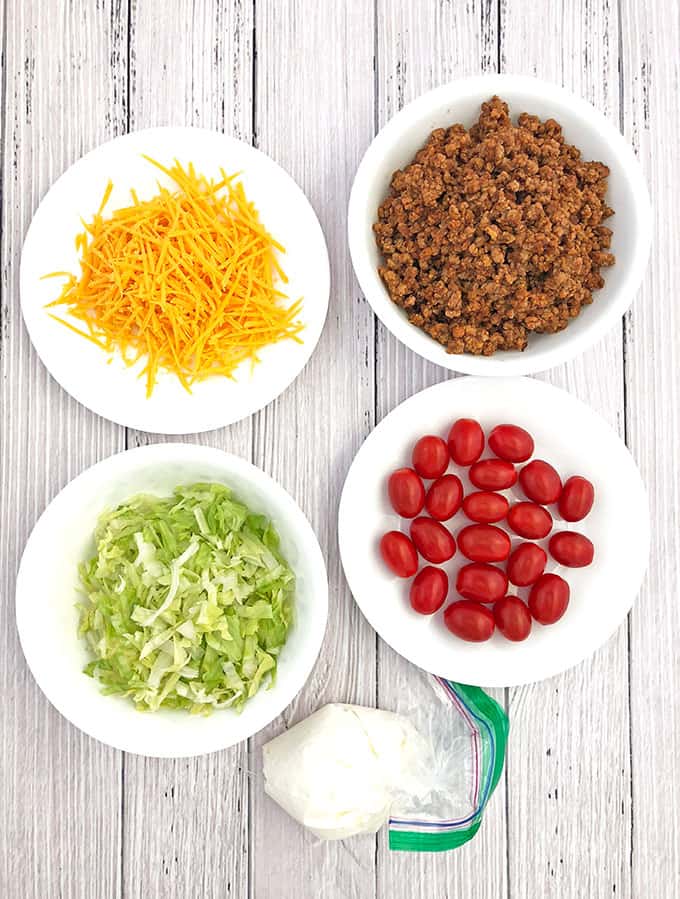 beautiful appetizers, cheddar cheese, Cinco de Mayo, decor appetizer, delicious appetizers, holiday food, kids aproved, kids love it, lettuce, mini cherry tomatoes, mini tacos, Taco Bites Appetizers