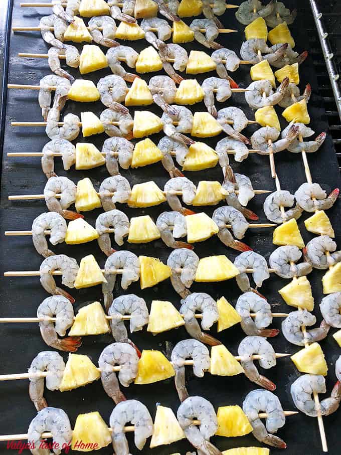 Place an oven mat on top of the grill grates. This is optional but I prefer using a mat to prevent it and pineapple from sticking to the grill grates.