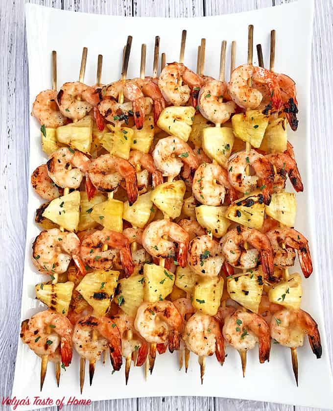 Remove the skewers from the grill and place them with the glazed side down.