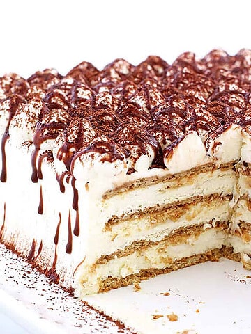 Tiramisu Cake combines tiramisu with cake for a treat you'll love! My recipe includes s'mores for a delicious American twist on this classic Italian dessert.