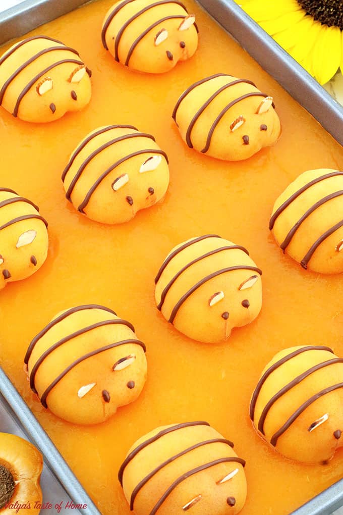 This Apricot Bee Cake Recipe is absolutely incredible! Spongy cake, fluffy cream, and the soft apricot jello give this adorable beehive themed cake a lot of flavors, every bite just melts in your mouth! And that fresh apricot bee not only gives a beauty to each slice of the cake but makes every kid and even an adult drop their jaw and wow! Plus, the more fruit the better! Right? Give it try!