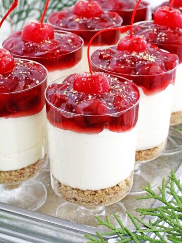 These No Bake​ Cherry Cheesecake Parfaits are not only beautiful, they are delicious, perfectly portioned décor dessert that is any party friendly.