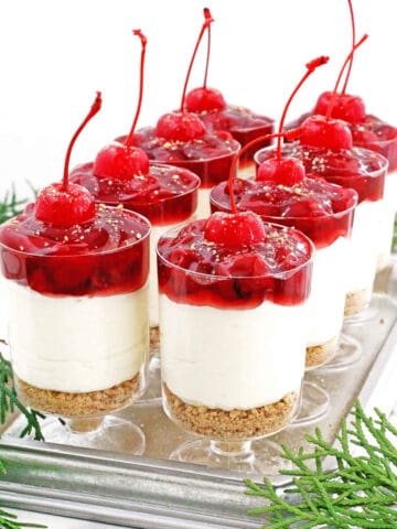 These beautiful, portion-controlled cheesecake parfaits are easy to make, holiday-ready, and have the perfect mix of sweet, tangy, and stunning tart cherry topping. They're guaranteed to be the showstopper at your next gathering.