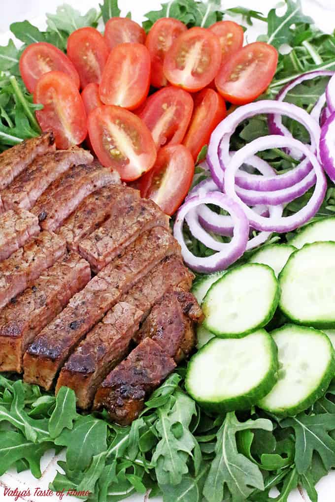 This Arugula Steak Salad with Balsamic Vinaigrette Dressing is very colorful, light, crunchy, flavorful, refreshing and satisfying, it is sure to impress! If your New Year’s resolution is to eat healthily or whether you want to detox your body I would recommend adding this superfood - ARUGULA to your diet. While most green vegetables are considered healthy and nutritious, arugula does stand out among the rest of the greens do to very low in calorie but high in calcium, iron and other nutrients.