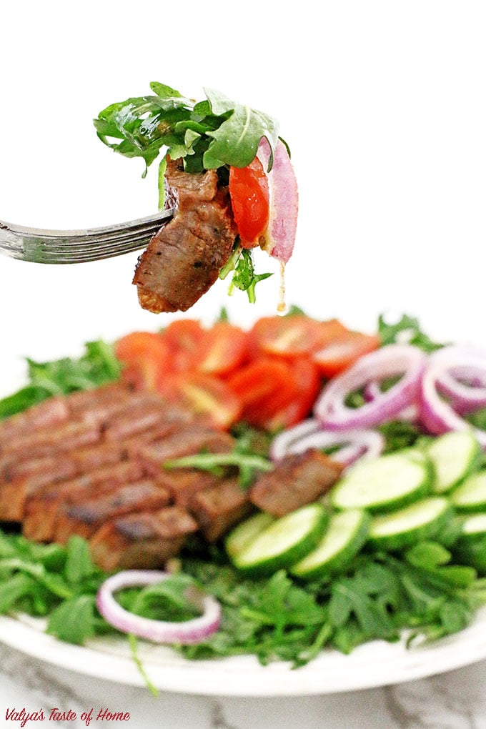 This Arugula Steak Salad with Balsamic Vinaigrette Dressing is very colorful, light, crunchy, flavorful, refreshing and satisfying, it is sure to impress! If your New Year’s resolution is to eat healthily or whether you want to detox your body I would recommend adding this superfood - ARUGULA to your diet. While most green vegetables are considered healthy and nutritious, arugula does stand out among the rest of the greens do to very low in calorie but high in calcium, iron and other nutrients.