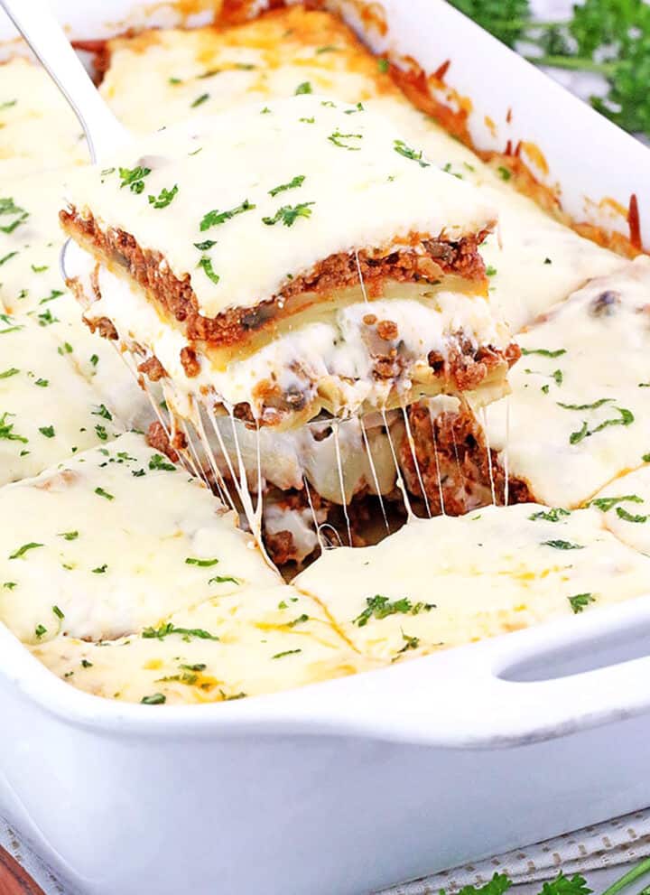 This Mushroom Lasagna features a delicious combination of mushroom and ground beef cooked in a tasty tomato-based sauce for a hearty, comforting dinner meal!