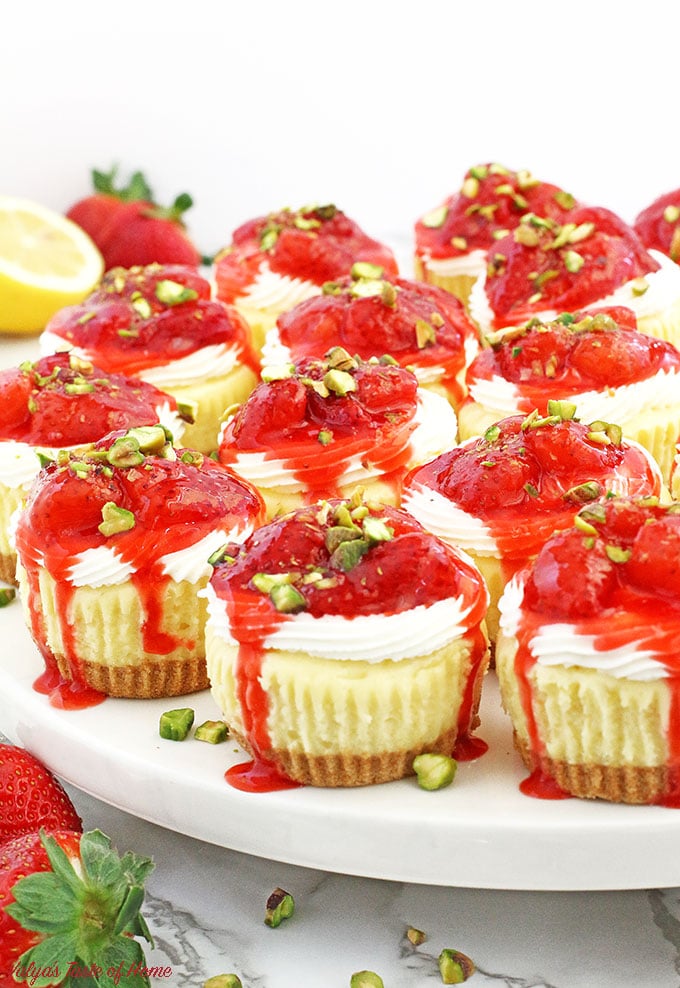 These Strawberry and Cream Mini Cheesecakes not only delicious, but just too cute to eat! They consist of creamy cheesecake filling, topped with tasty soft cream and chunky homemade strawberry sauce. Sprinkled pistachios not only finishes the beauty of these mini cheesecakes but gives delicious nutty flavor too.
