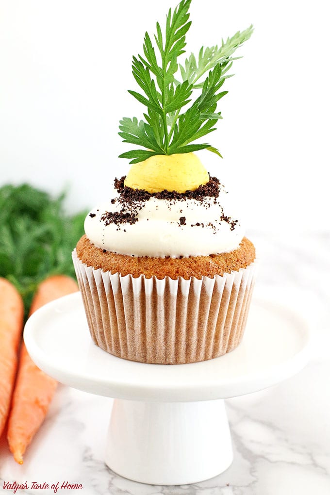 These Carrot Cupcakes with Greek Yogurt Cream Cheese Frosting are amazingly soft, light, moist, and packed with organic freshly grated carrots. Each cupcake is beautifully decorated to represent the growing carrot in the dirt.  The cream is very tasty and not sweet at all. The addition of Greek yogurt makes it taste soft and creamy, you will be licking your fingers off with every bite!