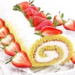 This Strawberry Vanilla Swiss Roll Recipe is the easiest and the quickest dessert you can ever make! Supper soft sponge cake topped with amazingly tasty (no cook) strawberry sauce, filled with super soft and fluffy cream, dusted with confectioners’ sugar and topped with loads of fresh strawberries.