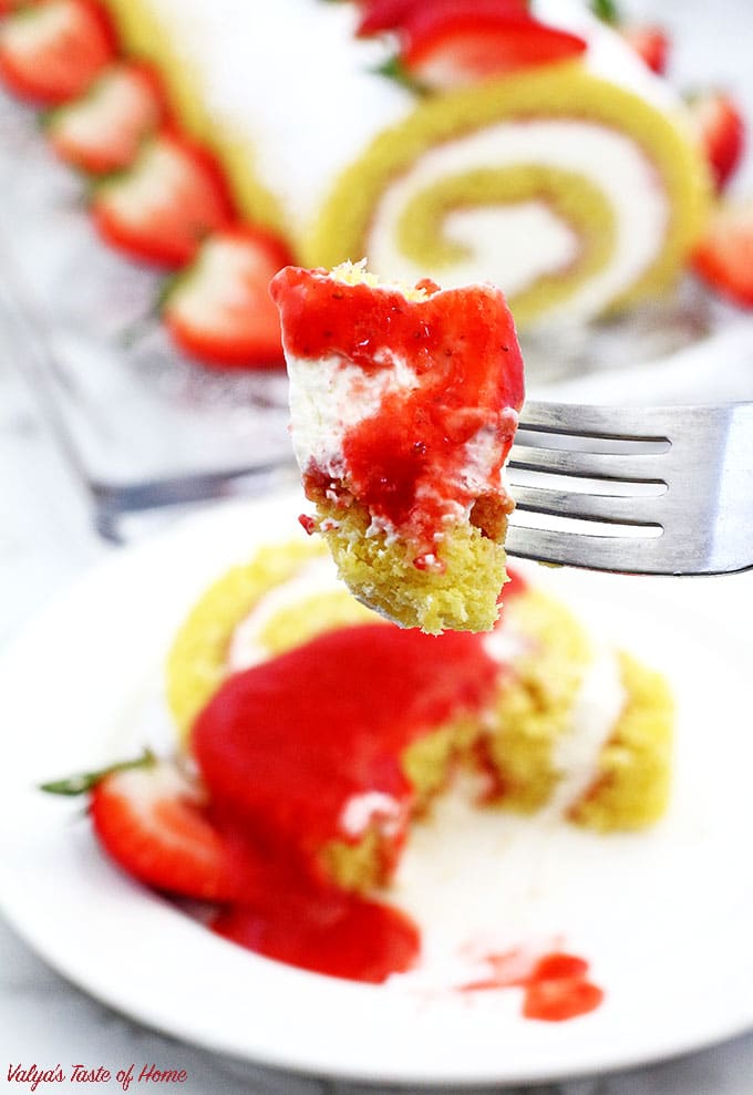 This Strawberry Vanilla Swiss Roll Recipe is the easiest and the quickest dessert you can ever make! Supper soft sponge cake topped with amazingly tasty (no cook) strawberry sauce, filled with super soft and fluffy cream, dusted with confectioners’ sugar and topped with loads of fresh strawberries.