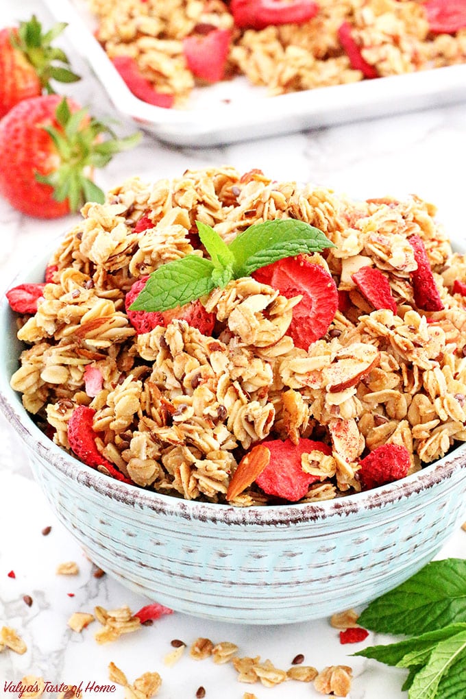 The title says it all! This Easy Strawberry Almond Granola Recipe is truly super easy and quick to make! It's so much healthier, cleaner, and tastier when made at home than a store bought. But seriously, what is there not to love about this granola when almonds and strawberries pair so well together! ;)