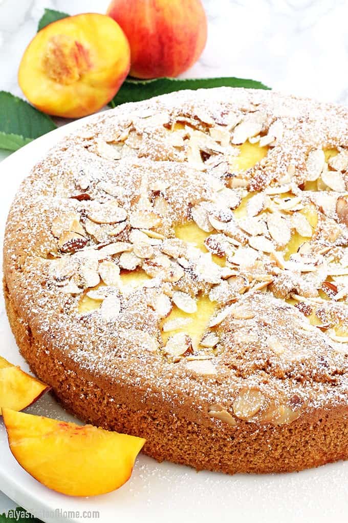 Who can resist a slice of this absolutely scrumptious Almond Peach Coffee Cake? It's light, fluffy, airy, moist, and loaded with peaches. The aroma of almond extract is phenomenal! Then topped and toasted almond slivers, making this cake not only beautiful but gives it a boost in taste as well. Every bite just melts in your mouth.