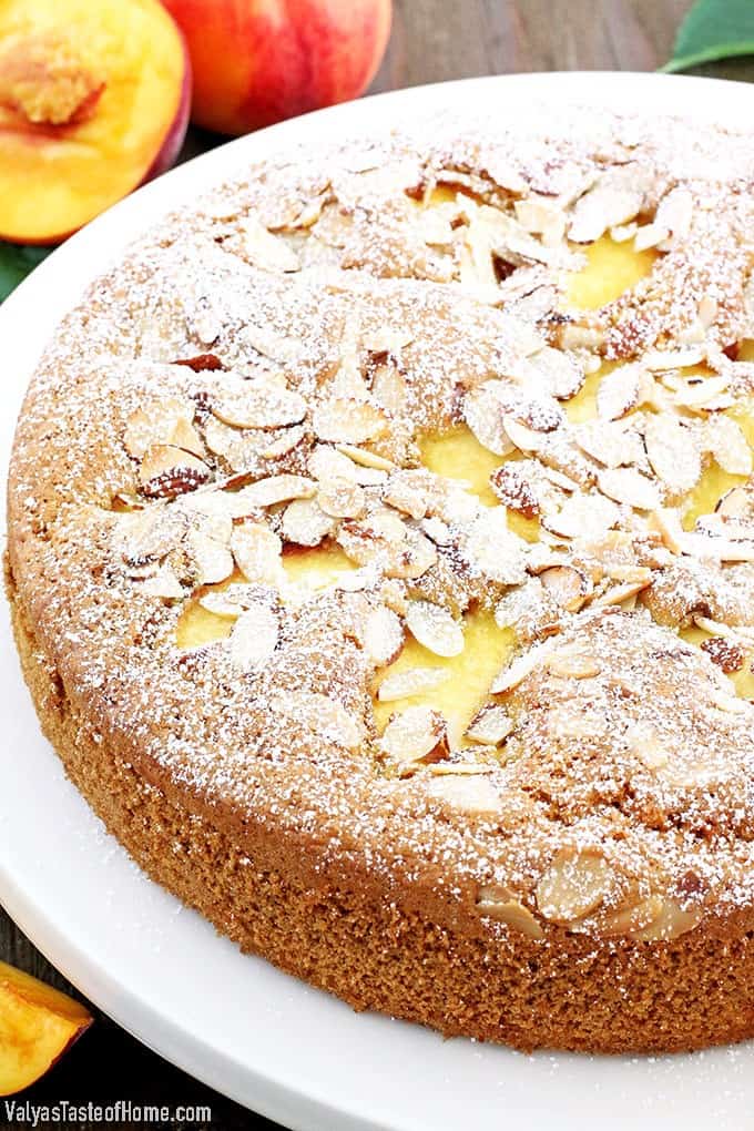 Who can resist a slice of this absolutely scrumptious Almond Peach Coffee Cake? It's light, fluffy, airy, moist, and loaded with peaches. The aroma of almond extract is phenomenal! Then topped and toasted almond slivers, making this cake not only beautiful but gives it a boost in taste as well.  Every bite just melts in your mouth. 