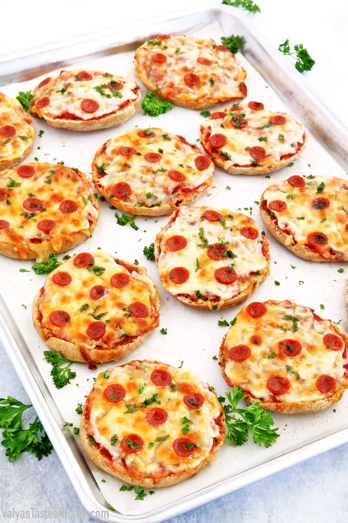 These English Muffin Mini Pepperoni Pizzas is a great project for the kiddos. It takes just a few basic ingredients, but the little ones love making them. They feel like they cooked their own pizza! #cookingwithkids #minipizzas #englishmuffinminipizzas #valyastateofhome