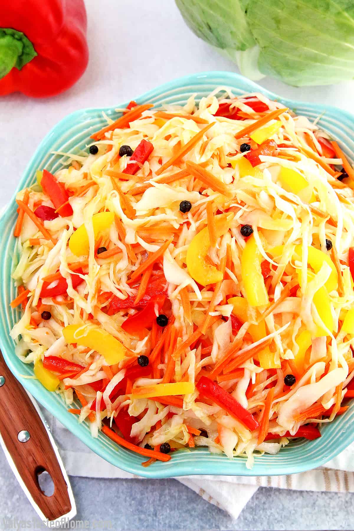 This Cabbage Carrots and Peppers Salad recipe is not one of those salads that you really taste the sharpness of fresh vegetables. It tastes more like a marinated salad and has a bit of a sweet and sour taste to it. The best thing I like about this salad is that you can make it ahead of time which helps avoid those last-minute preparation rushes.  #cabbagecarrotspepperssalad #marinatedsalad #easymarinatedvegetablesalad #valyastasteofhome