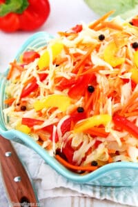 This Cabbage Carrots and Peppers Salad recipe is not one of those salads that you really taste the sharpness of fresh vegetables. It tastes more like a marinated salad and has a bit of a sweet and sour taste to it. The best thing I like about this salad is that you can make it ahead of time which helps avoid those last-minute preparation rushes. #cabbagecarrotspepperssalad #marinatedsalad #easymarinatedvegetablesalad #valyastasteofhome