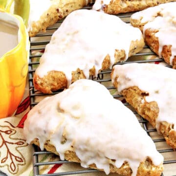 These Pumpkin Scones are soft, flaky, buttery, and bursting with cinnamon and pumpkin flavors.
