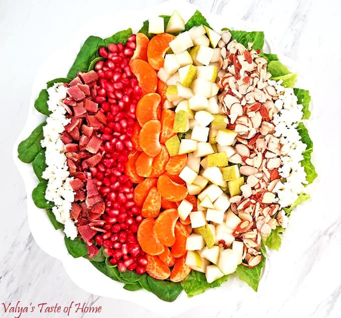 This bright and colorful Pear, Pomegranate, Mandarin Winter Salad with Homemade Ranch Dressing and some of the winter harvested fruit is so scrumptious! #wintersaladrecipe #homemaderanch #valyastasteofhome