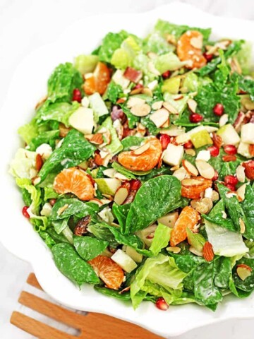 This bright and colorful Pear, Pomegranate, Mandarin Winter Salad with Homemade Ranch Dressing and some of the winter harvested fruit is so scrumptious! #wintersalad #veggiewintersalad #easysaladrecipe #valyastasteofhome.com