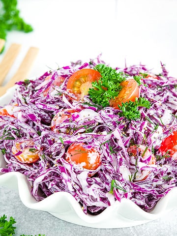 This Purple Cabbage Salad is a colorful and flavorful dish that's perfect as a refreshing and healthy meal.