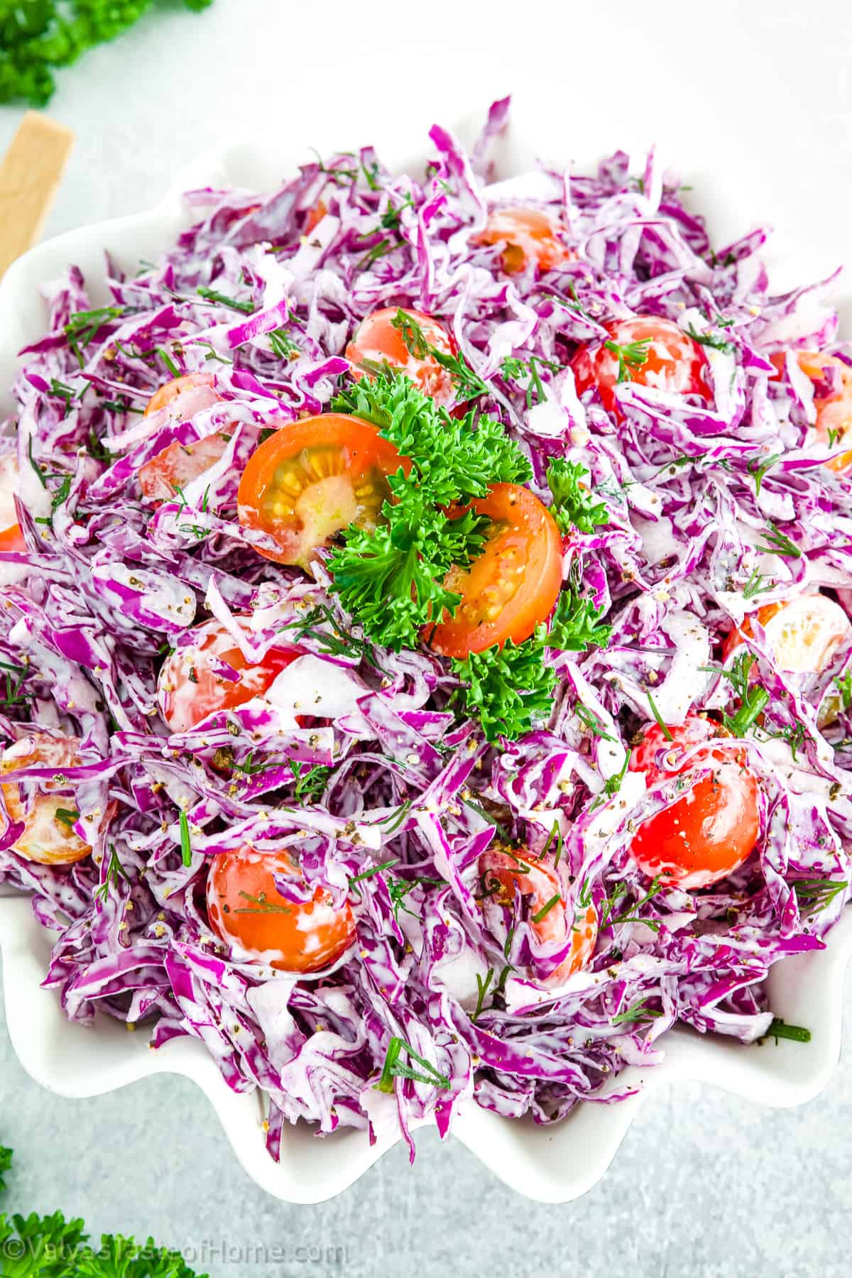 Purple cabbage salad is a colorful and flavorful dish that combines fresh ingredients with a homemade dressing for an irresistible combination.